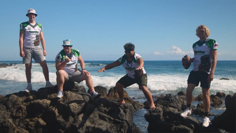 Hawaii Tiki Bowl Players posing by the Ocean